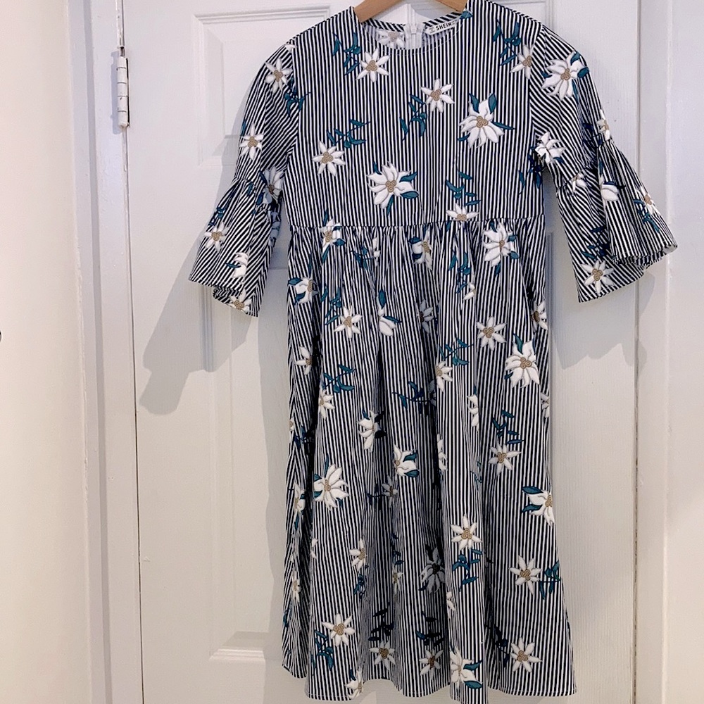 Nice mid length girls dress with stripes and flowers.